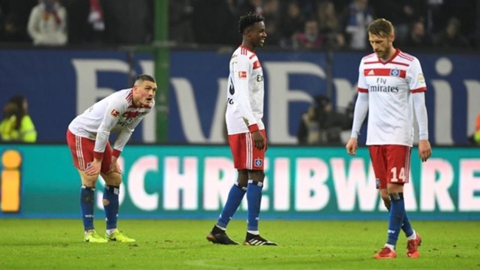 Hamburg players Kyriakos Papadopoulos, Gideon Jung and Aaron Hunt
